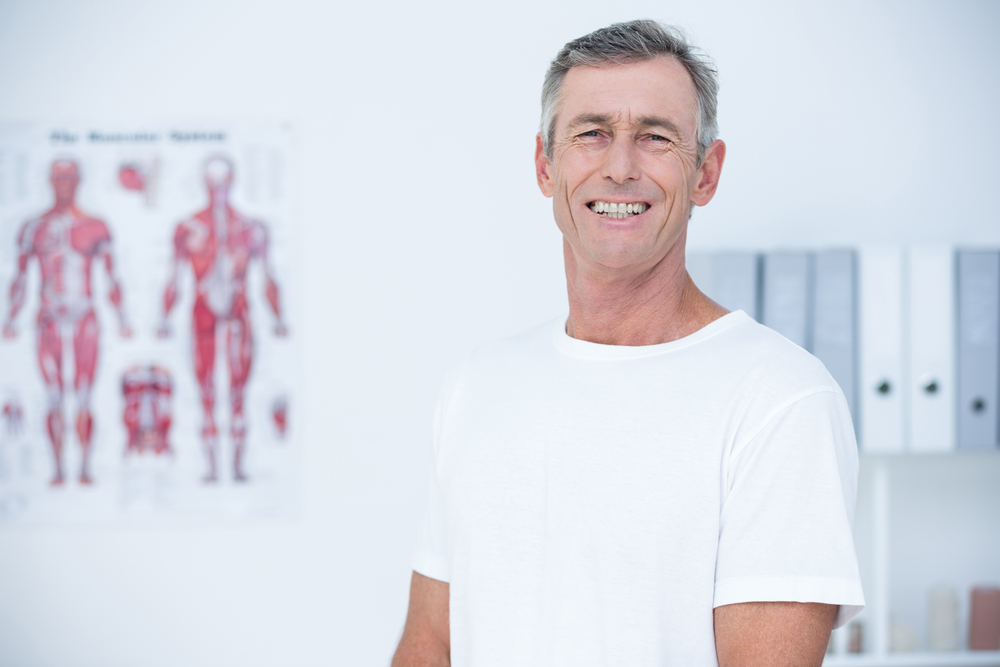 Smiling patient looking at camera in medical office Smiling patient looking at camera in medical office