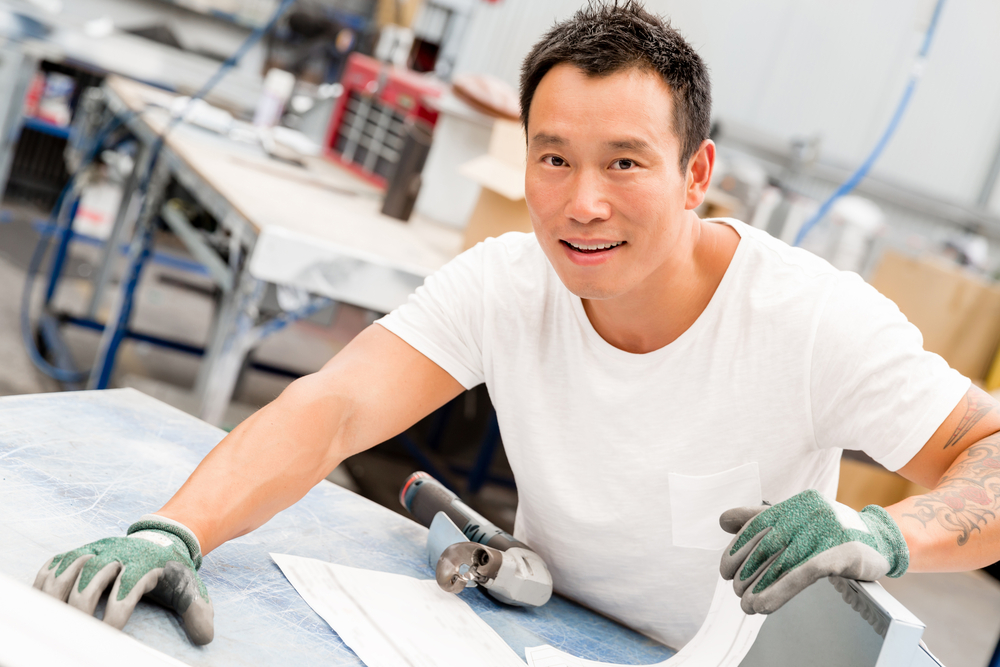 portrait of asian worker in production plant working on the factory floor portrait of asian worker in production plant working on the factory floor